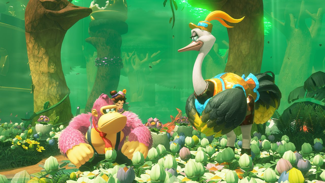 Donkey Kong beside an ostrich companion in a lush green cavern