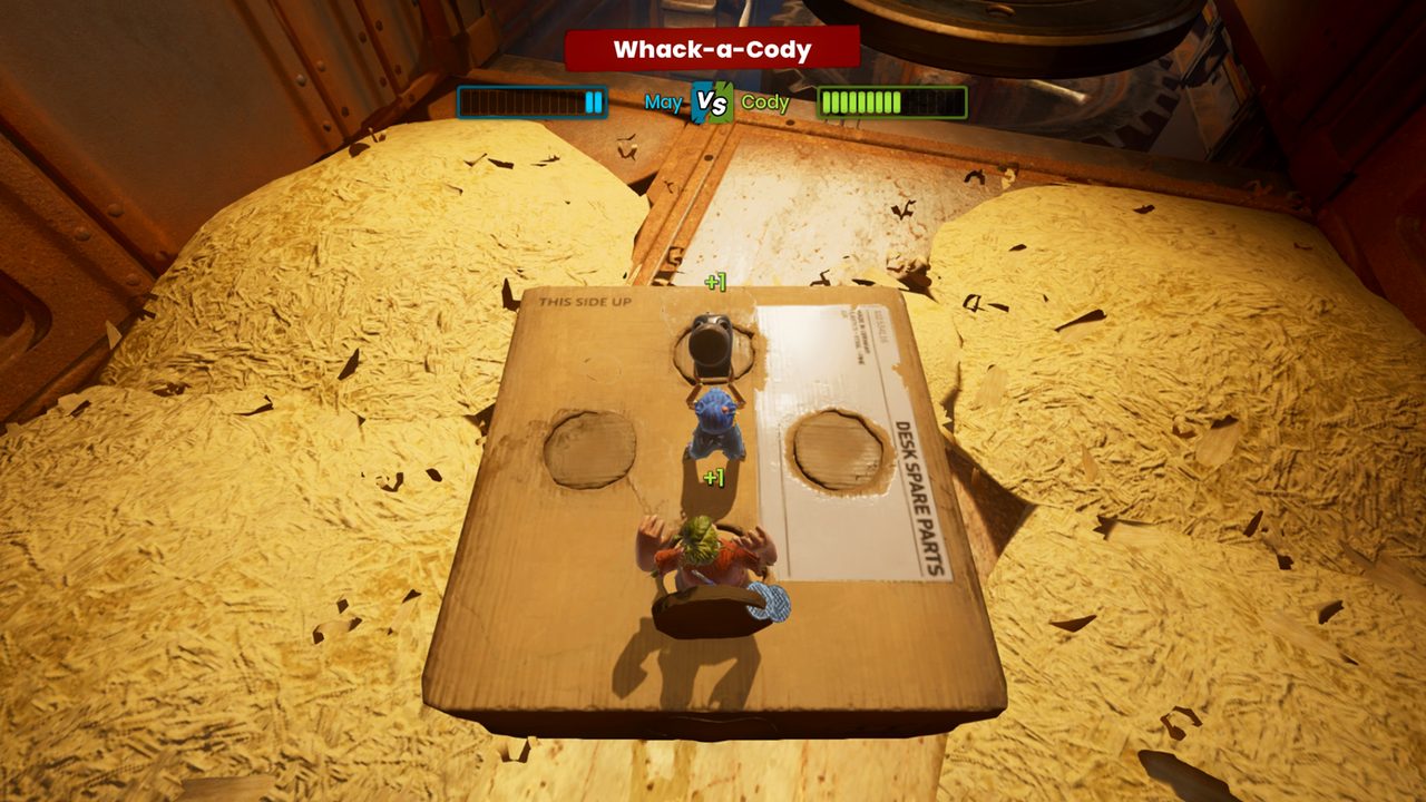 A head-to-head minigame played on a sheet of cardboard