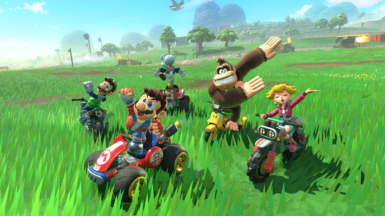 Drivers celebrating in a grassy meadow