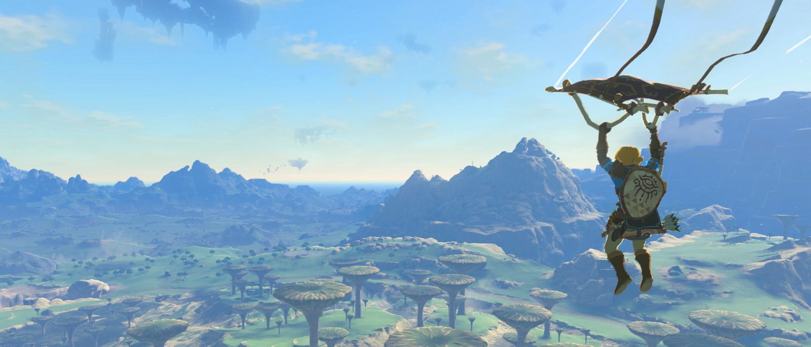 Link gliding high above Hyrule under a clear sky